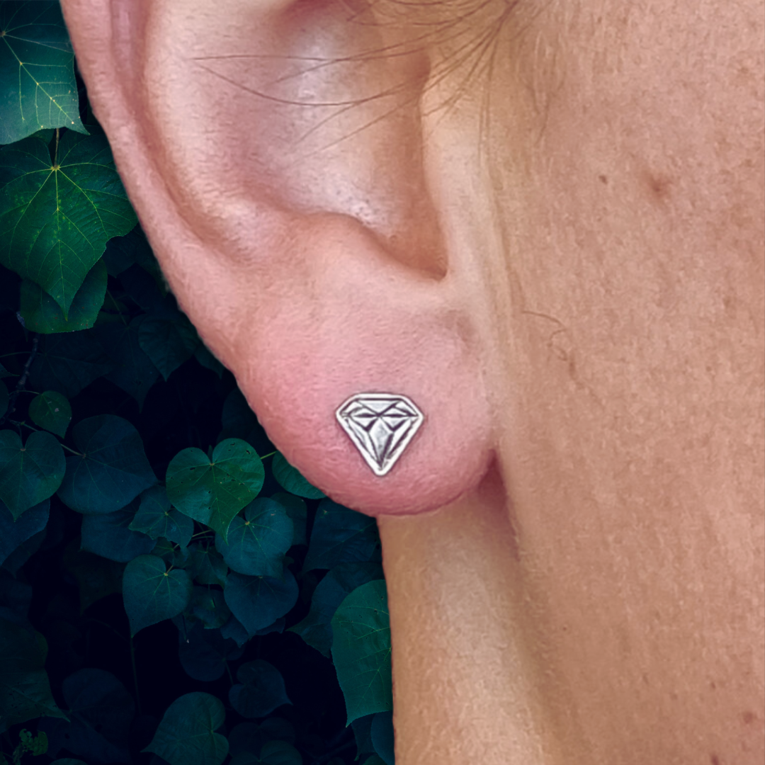 Handcrafted sterling silver diamond-shaped stud earrings, perfect for adding a touch of elegance to any outfit