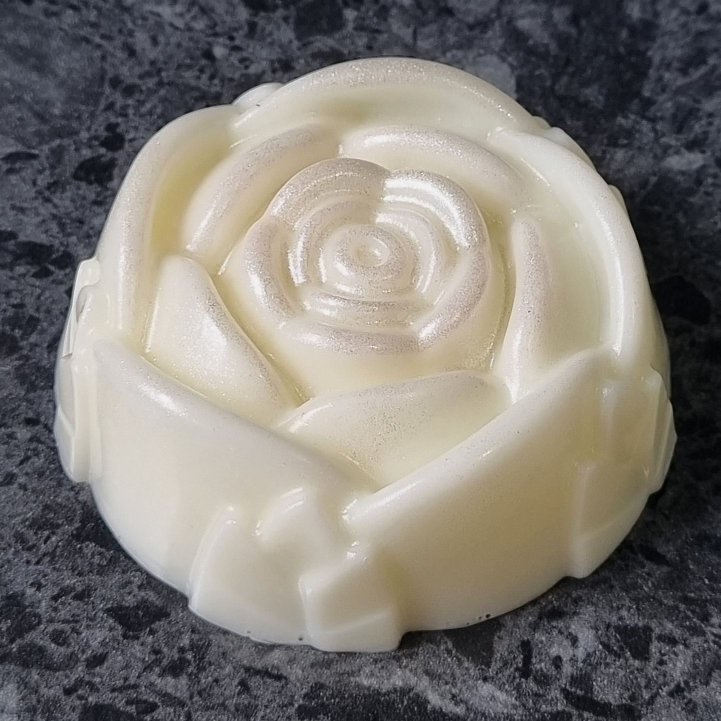 Rose-shaped white soap with subtle shimmer